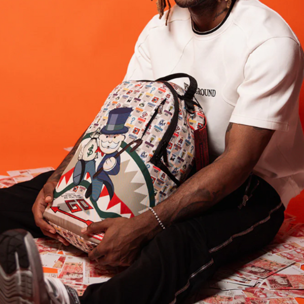 SPRAYGROUND MONOPOLY GOTTA GO DLXSR BACKPACK